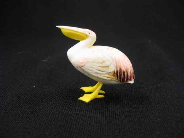 Appraisal: Carved Ivory Figurine of a Pelican signed polychrome details ''