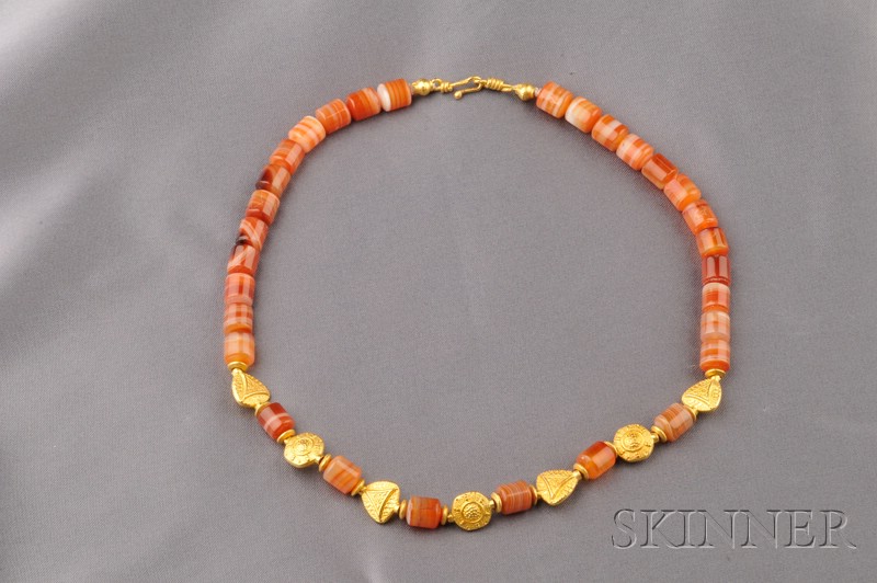 Appraisal: kt Gold and Agate Bead Necklace composed of barrel shape