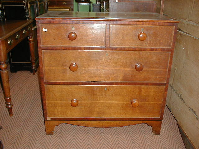 Appraisal: A Victorian cross banded oak and mahogany chest with knob