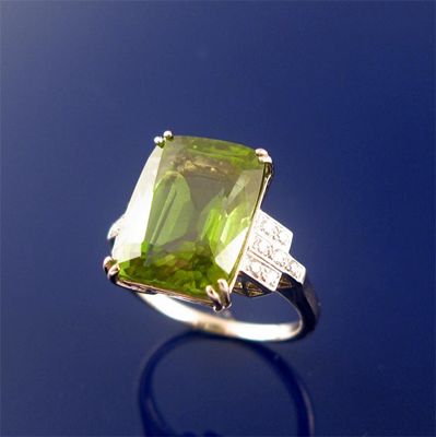 Appraisal: A peridot and diamond ring the cushion shaped peridot is