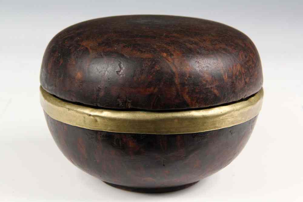 Appraisal: COVERED BOX- burl wood with a gilt brass rim Tibetan