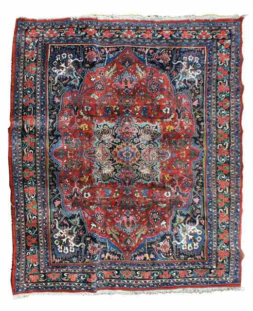 Appraisal: A PERSIAN BIDJAR RED GROUND CARPET with a large central