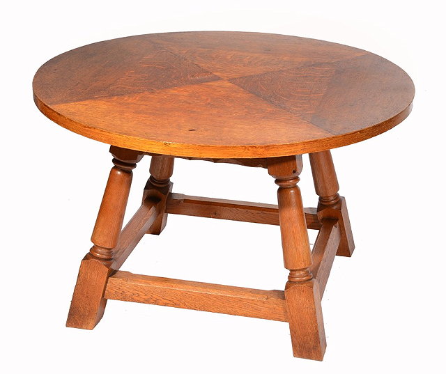 Appraisal: AN OAK CIRCULAR COFFEE TABLE attributed to Heals on four