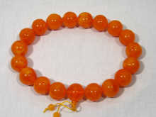 Appraisal: A row of large amber beads each approx cm diameter