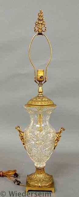 Appraisal: French crystal and bronze table lamp with grotesque mask handles