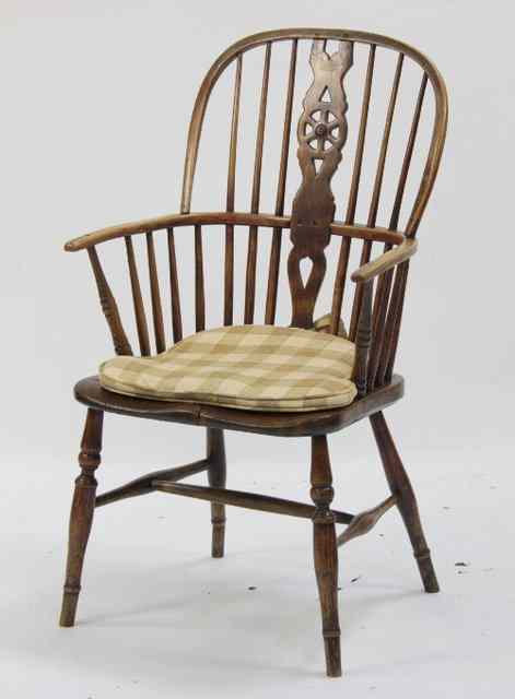 Appraisal: A th Century ash and elm wheelback Windsor armchair