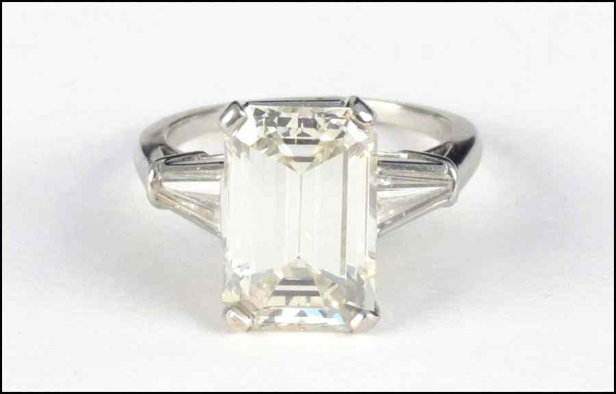 Appraisal: PLATINUM AND DIAMOND RING Emerald cut diamond is VS clarity