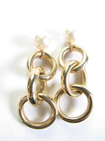 Appraisal: A pair of K yellow gold triple-circle-drop earring jackets with