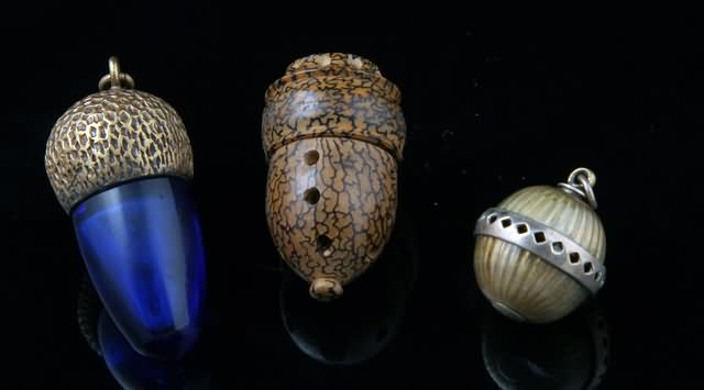 Appraisal: Two of acorn form and an orb shaped vinaigrette length