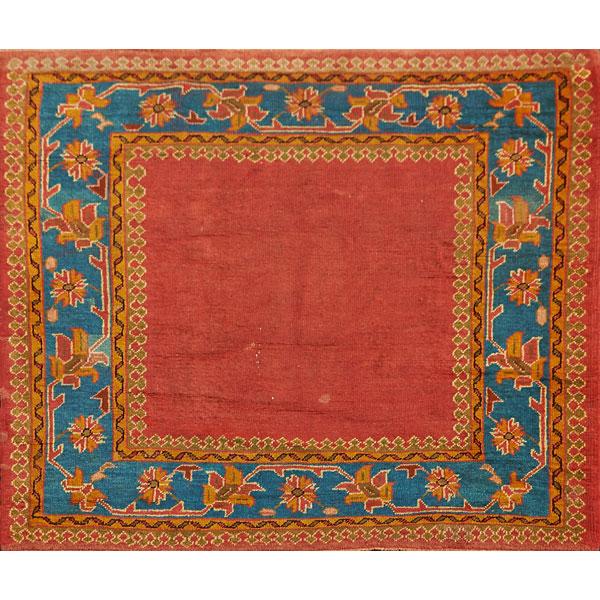 Appraisal: TURKISH ORIENTAL AREA RUG Turquoise border on burnt orange ground