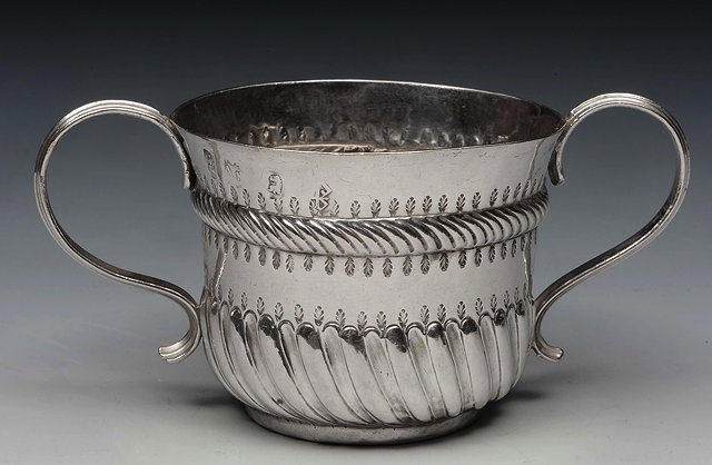 Appraisal: A QUEEN ANNE BRITANNIA GRADE SILVER PORRINGER with fluted lower