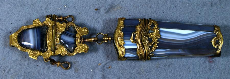 Appraisal: Banded agate chatelaine with gilt mounts about long Estimate -