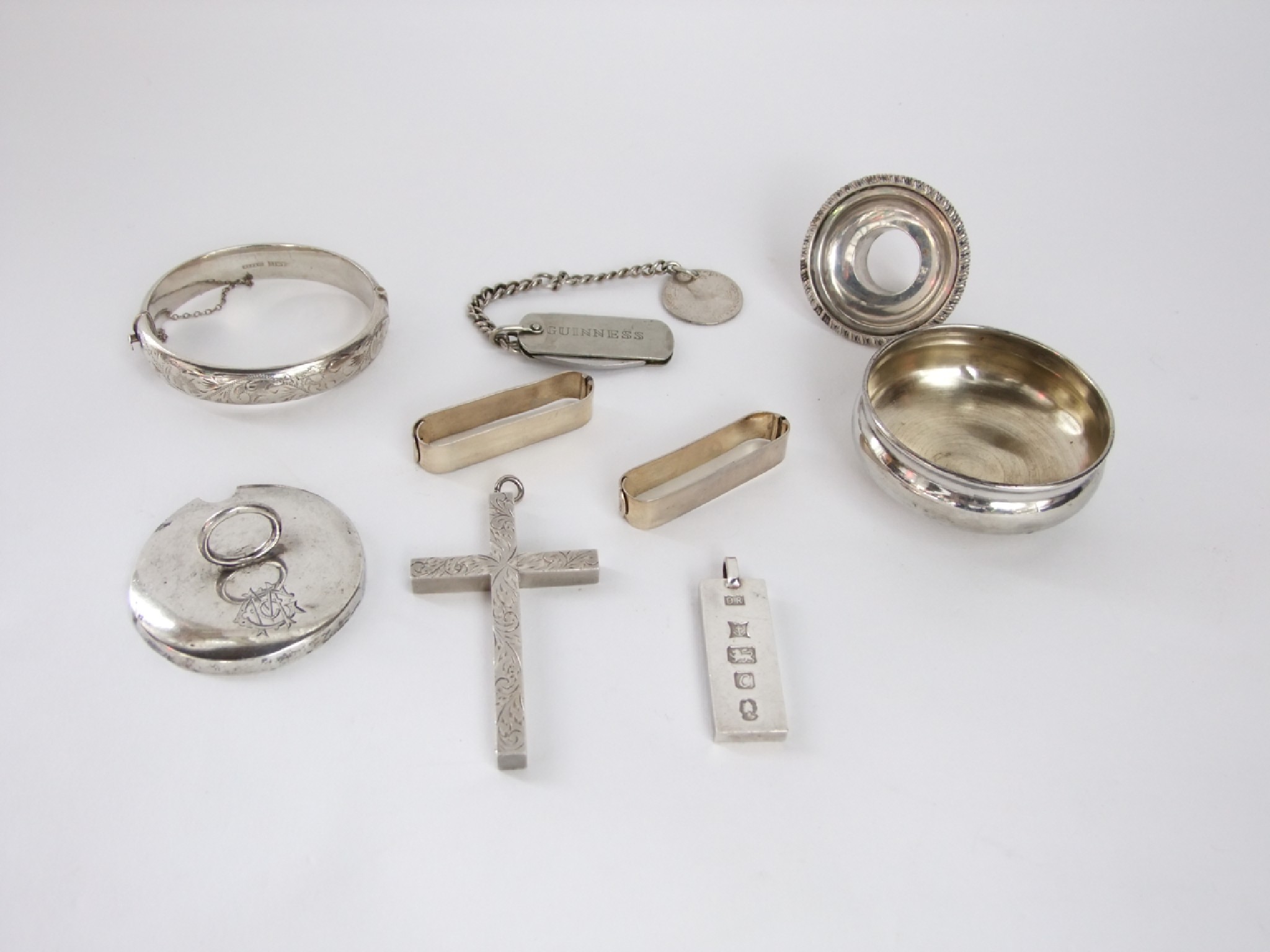 Appraisal: A collection of silver including an engraved cross ingot plain