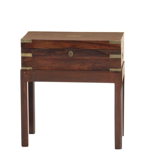 Appraisal: Rosewood and brass-bound lap desk on stand th century hinged