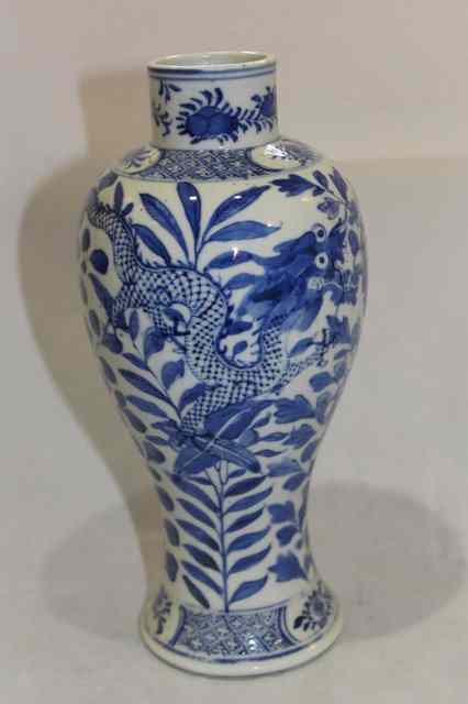 Appraisal: A CHINESE BLUE AND WHITE PORCELAIN BALUSTER VASE decorated dragons