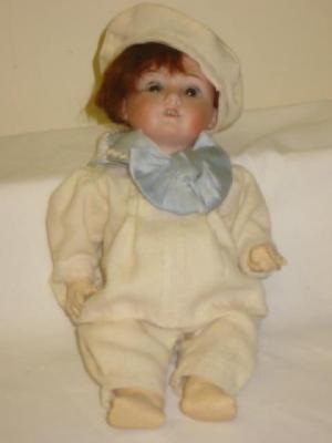 Appraisal: A Hermann Steiner bisque head girl doll with brown glass