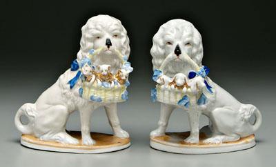 Appraisal: Pair porcelain seated dogs holding baskets of puppies and kittens