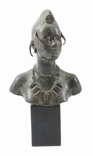 Appraisal: A patinated bronze figure of a Nubian th century height