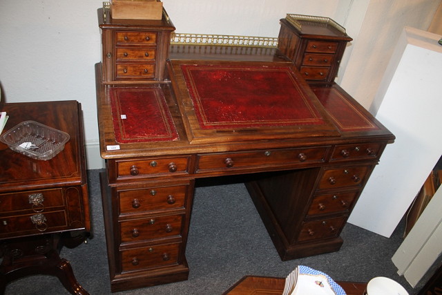 Appraisal: A VICTORIAN MAHOGANY DICKENS DESK having a sloped top fitted