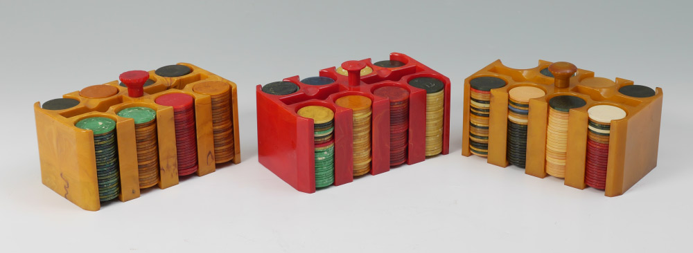 Appraisal: BAKELITE POKER CHIP HOLDERS AND CHIPS chip caddies total yellow