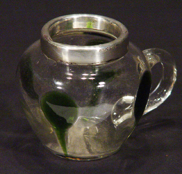 Appraisal: Clear glass pot with silver rim and green applied strap