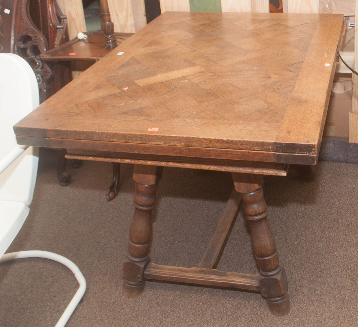 Appraisal: Oak trestle table with pull-out leaves Undernumber