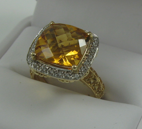 Appraisal: CITRINE DIAMOND AND FOURTEEN KARAT GOLD RING set with a