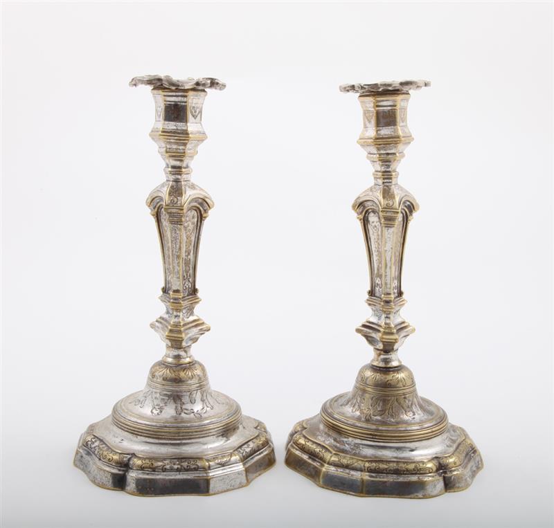 Appraisal: PAIR OF FRENCH REGENCE SILVERED BRASS CANDLESTICKS Each triangular tapered