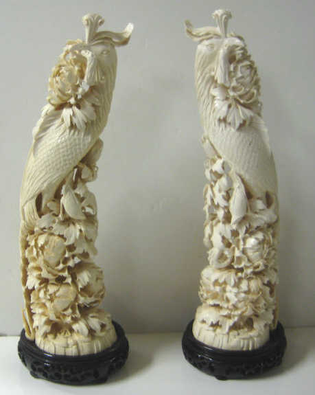 Appraisal: LARGE PAIR OF CHINESE IVORY PHOENIX GROUPS Each finely carved