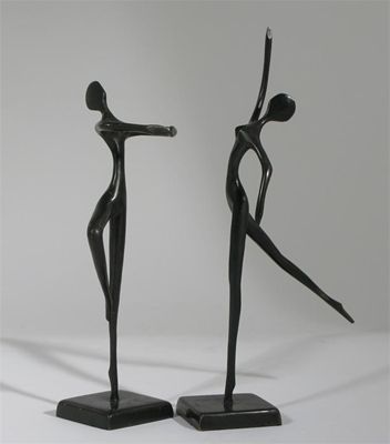 Appraisal: A pair of patinated metal dancing figures in the style