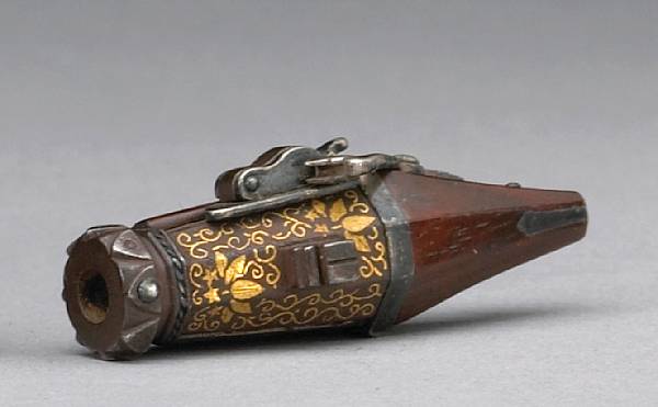 Appraisal: A boxwood and lacquer model of a hand cannon th