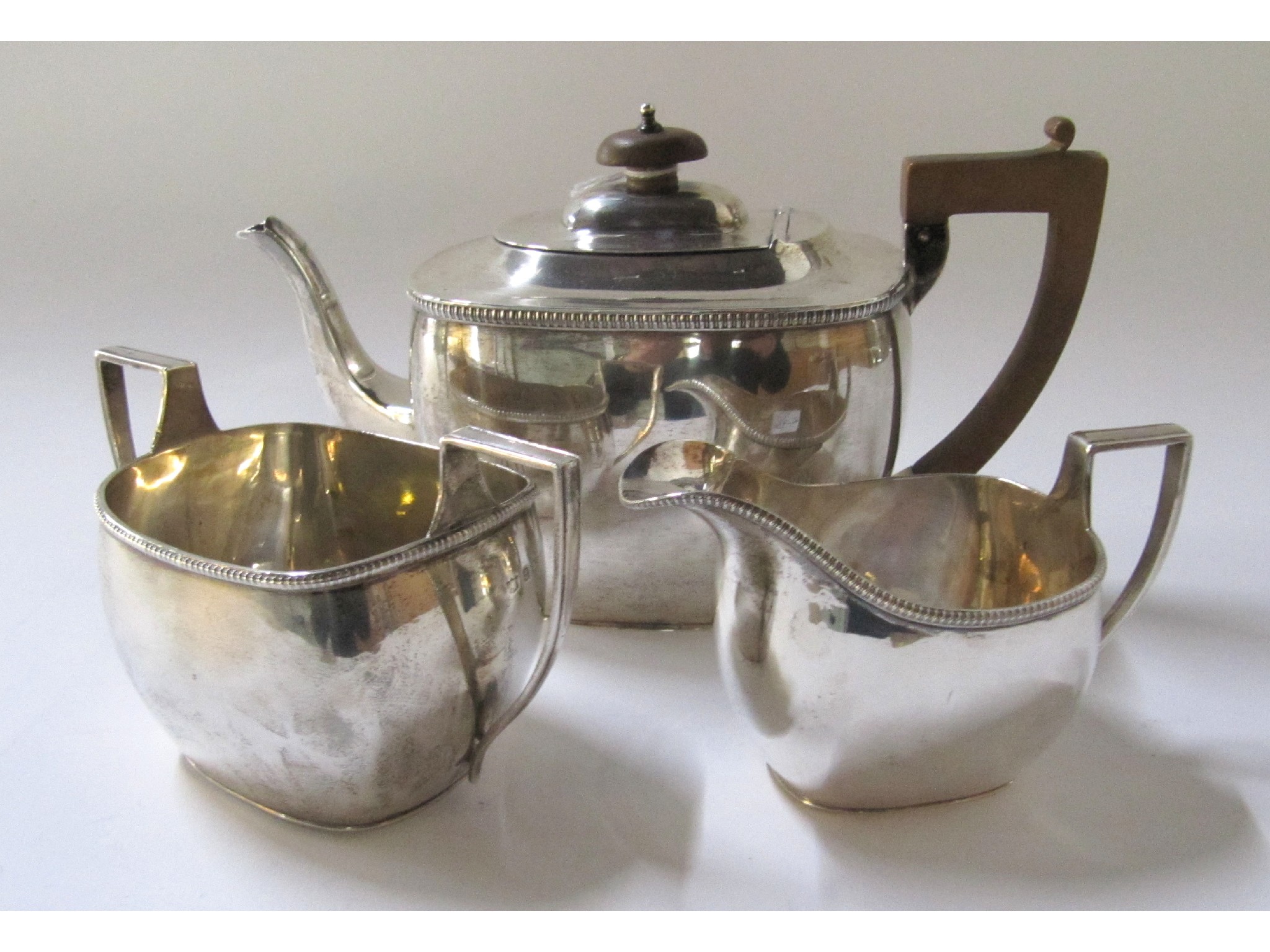 Appraisal: A three piece silver tea service Birmingham oz