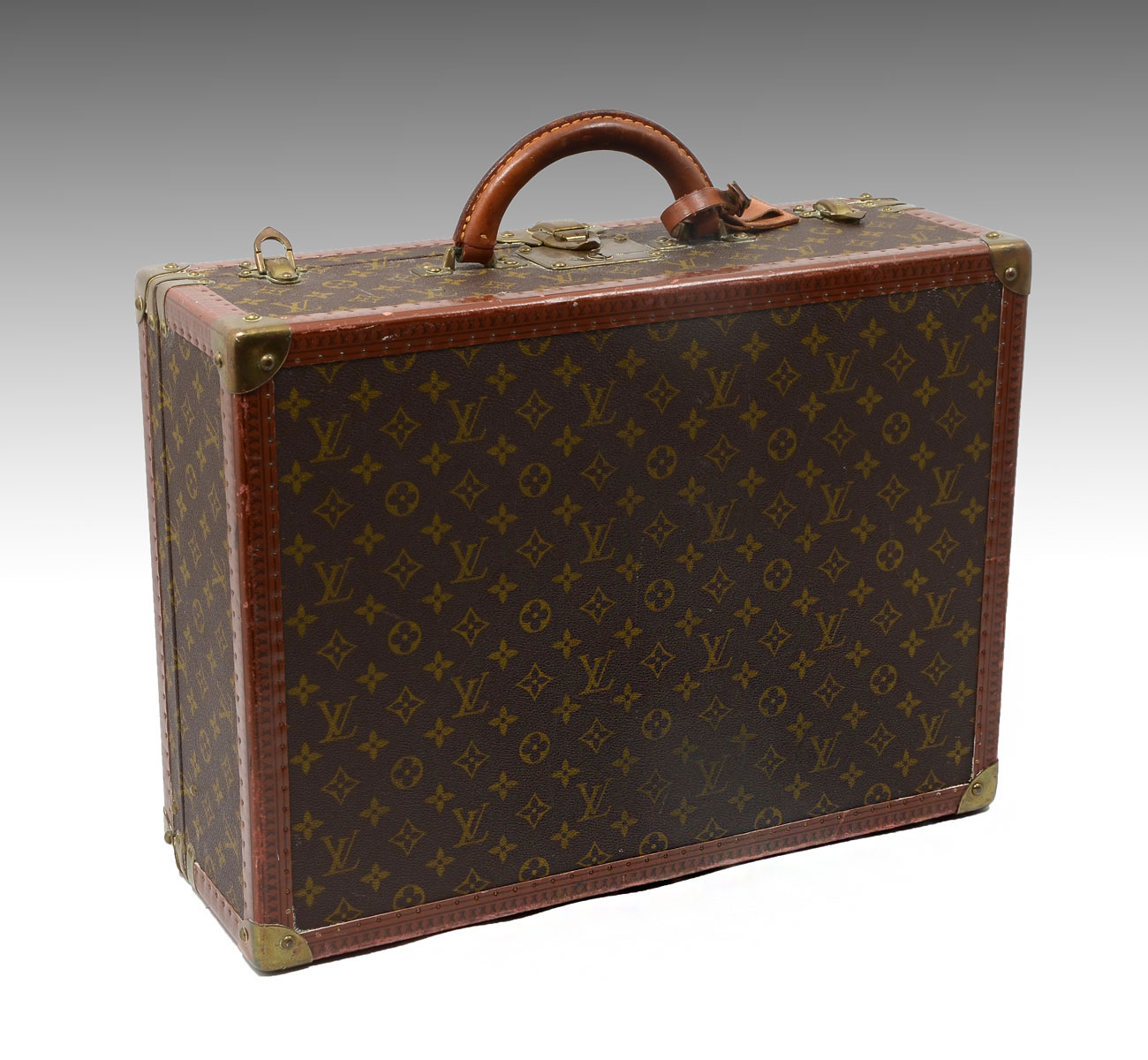 Appraisal: RARE MEDIUM VINTAGE LOUIS VUITTON SUITCASE Canvas and leather hard