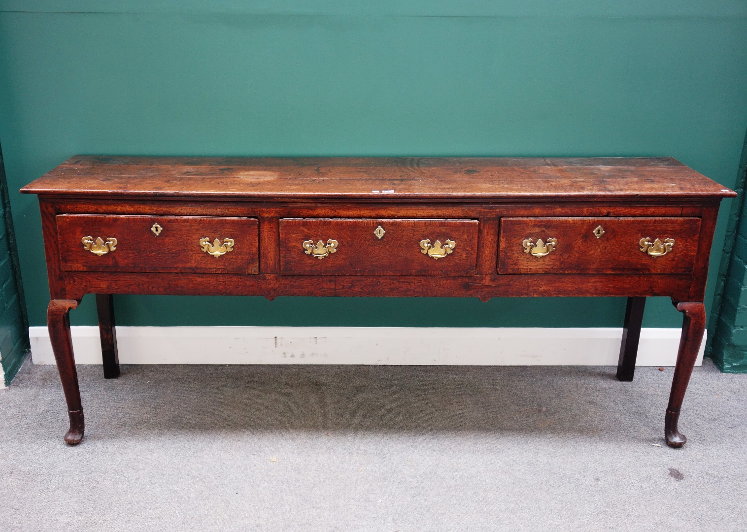 Appraisal: A mid- th century oak dresser base with three frieze