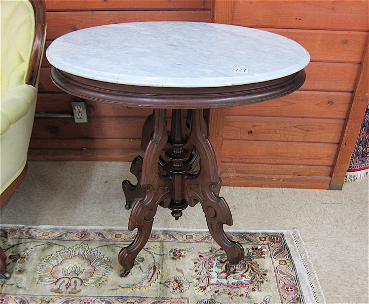 Appraisal: VICTORIAN MARBLE-TOP WALNUT LAMP TABLE Rococo Revival style American last