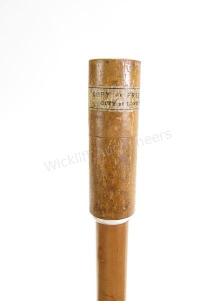 Appraisal: English Copy of Freedom Cane solid wood shaft cylindrical wooden