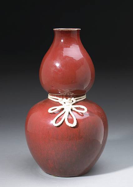 Appraisal: A flamb red glazed porcelain double-gourd form vase th Century