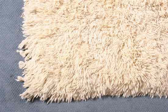 Appraisal: NATURAL WOOL MOROCCAN RUG - ft in x ft in