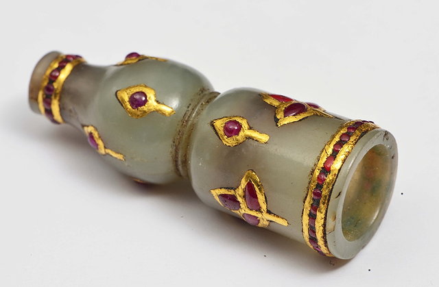 Appraisal: A MUGHAL JADE HOOKAH MOUTHPIECE studded with red gems th