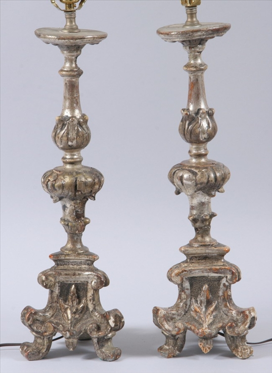 Appraisal: PAIR ITALIAN BAROQUE-STYLE CARVED AND SILVERED ALTAR STICKS th century