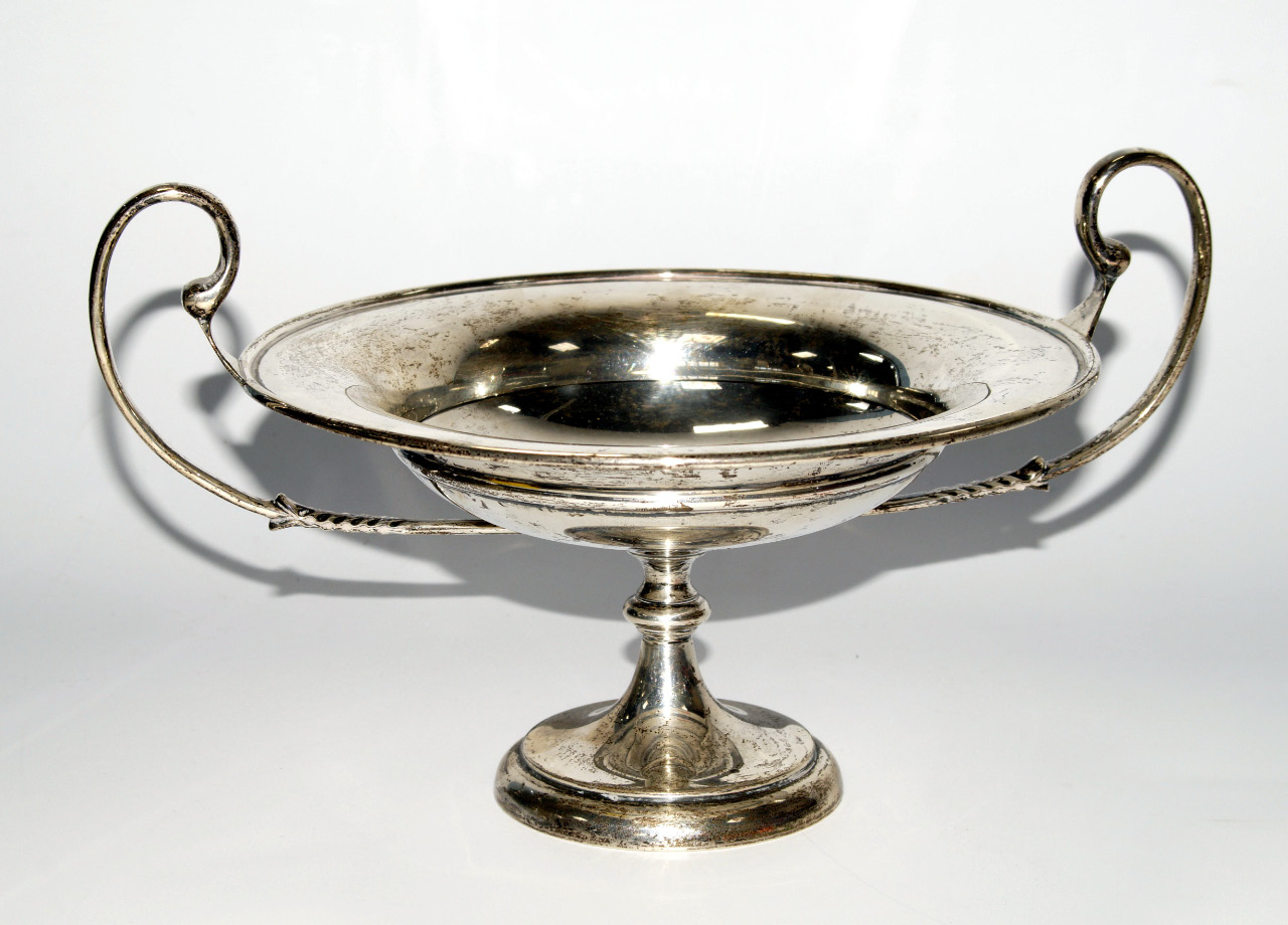 Appraisal: An Edwardian two handled circular comport of shallow urn shaped