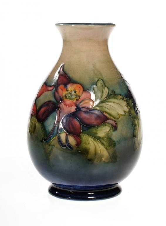 Appraisal: A MOORCROFT COLUMBINE VASE DESIGNED BY WALTER MOORCROFT cm h