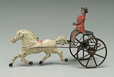 Appraisal: Painted tin horse and rider push toy red coated rider