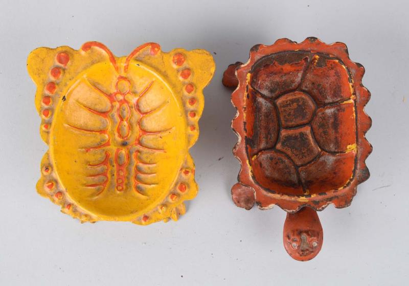 Appraisal: Cast Iron Soap Dishes Includes turtle and butterfly Condition Excellent