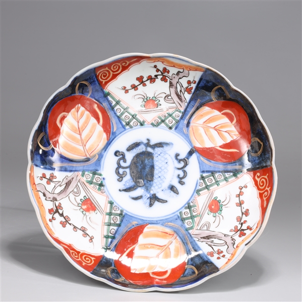 Appraisal: Japanese porcelain Imari plate with alternating panels of a leaf