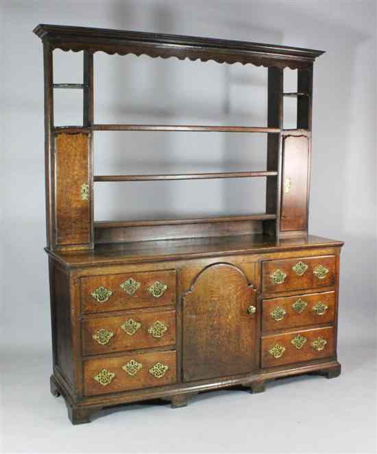 Appraisal: A George III oak dresser with three tier open back