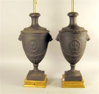 Appraisal: Pair of neoclassical style painted metal lamps Basalt style with