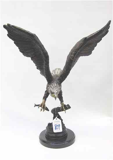 Appraisal: POLYCHROME BRONZE WILDLIFE SCULPTURE of an eagle with fish wings