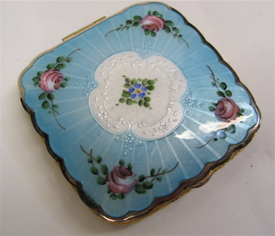 Appraisal: FRENCH ENAMEL AND GILT METAL COMPACT c The rectangular compact