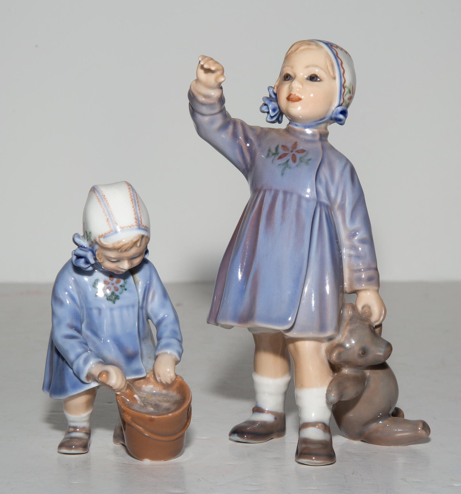 Appraisal: TWO DAHL JENSEN COPENHAGEN PORCELAIN FIGURES Comprising a Girl with